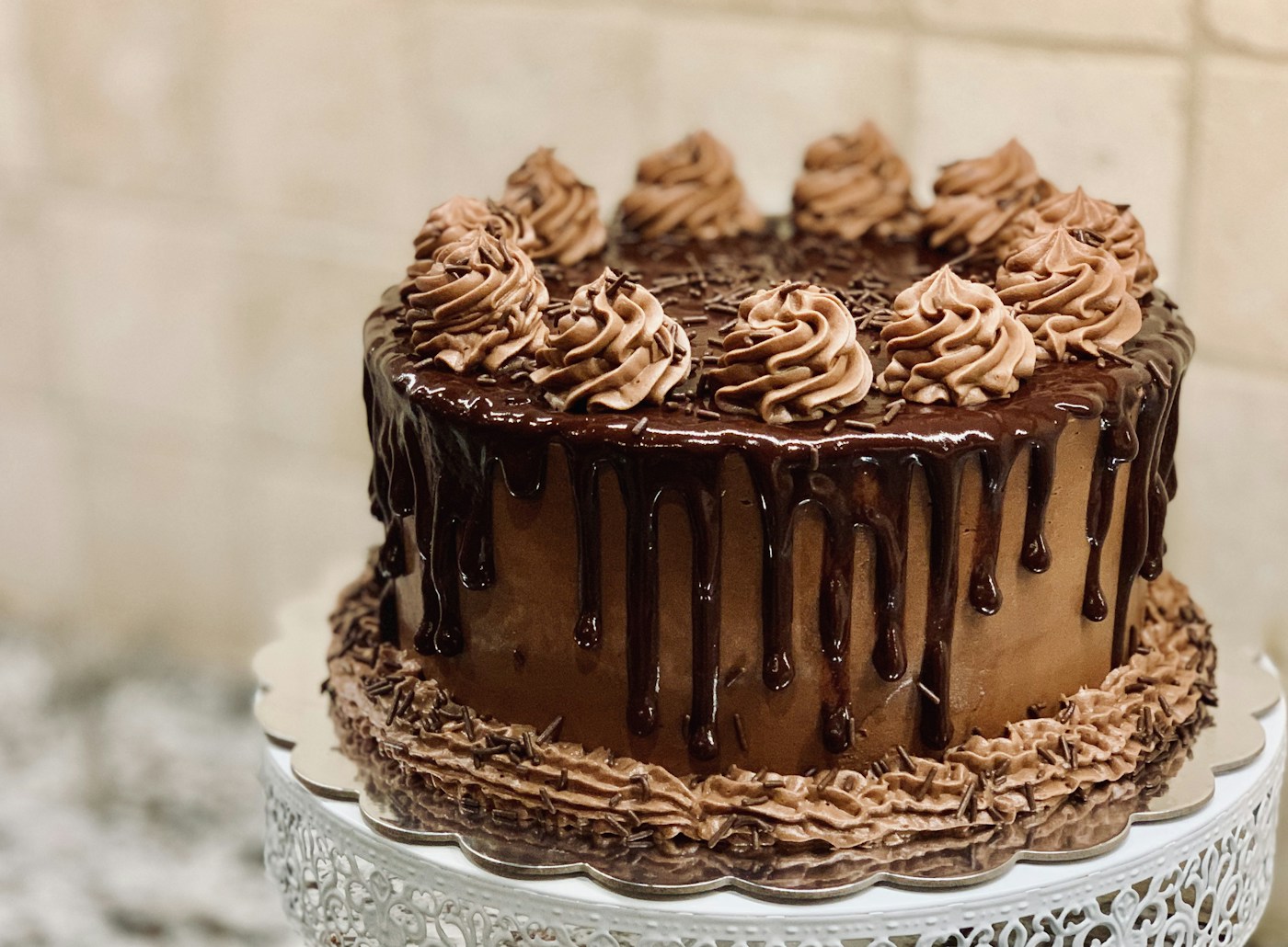 Chocolate celebration cake with piped frosting